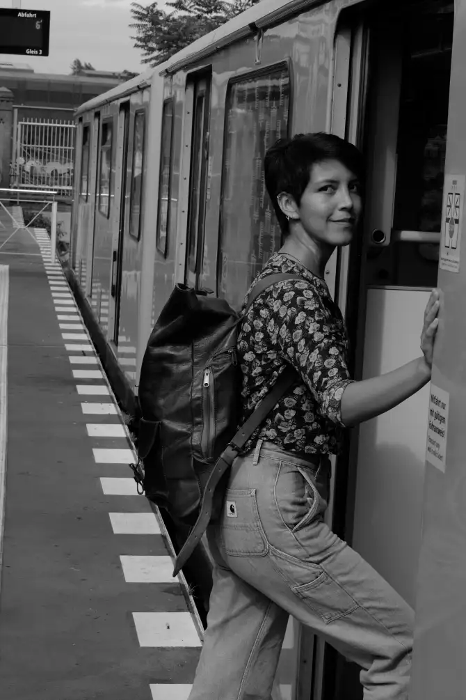 Photos of Ursula going on a walk, holding a instant camera, and exploring the city.