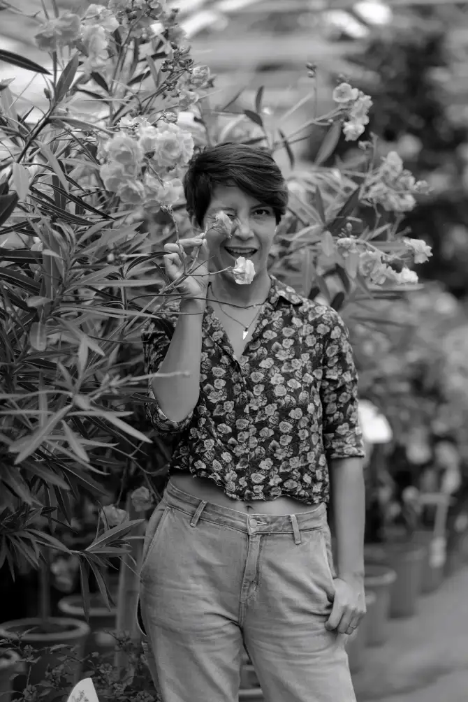 Photos of Ursula going on a walk, holding a instant camera, and exploring the city.