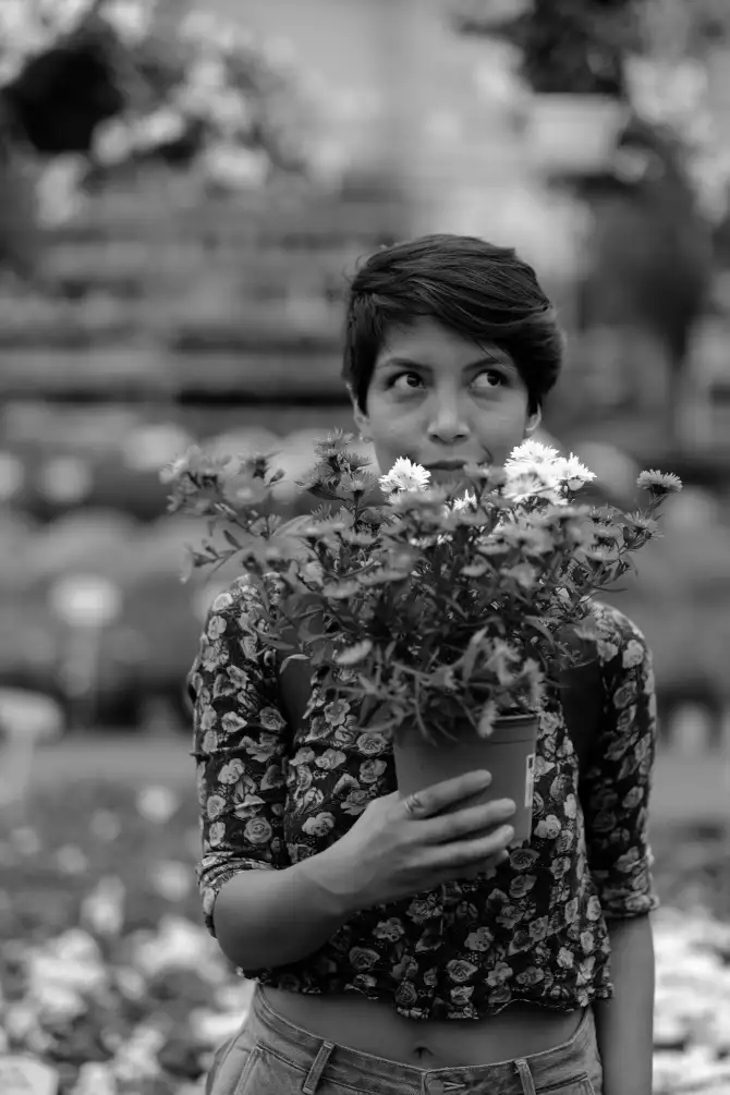 Photos of Ursula going on a walk, holding a instant camera, and exploring the city.